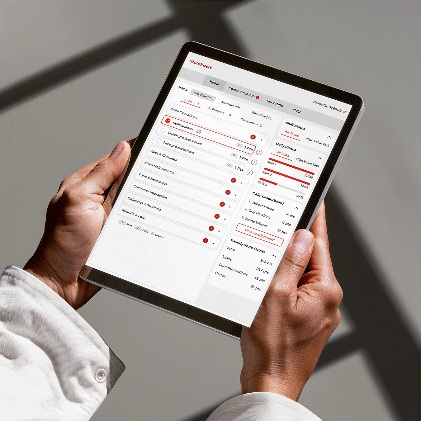 StoreXpert interface on an iPad, held in hand, following the iterative design and feedback loop